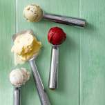 Zeroll ice cream scoops and spades, shown holding scoops of ice cream.