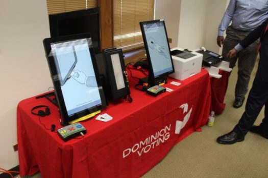 Dominion voting equipment with ballot printers.