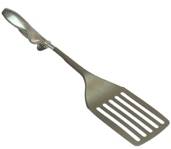 A metal spatula with a trigger mechanism.