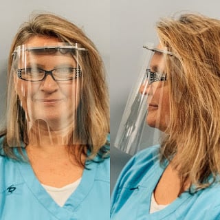 A woman wearing eyeglasses and a face shield, front and profile views.