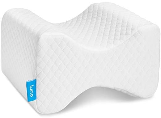 Contoured knee pillow made of wrapped firm foam