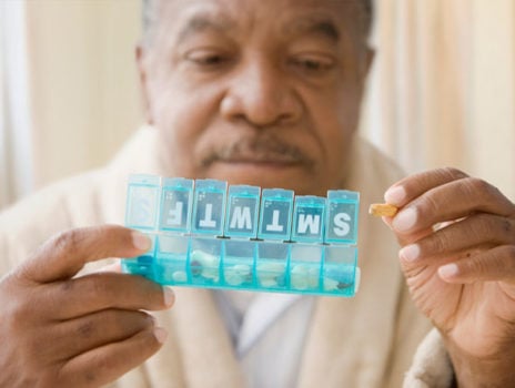 A man using a pill box