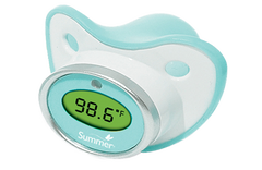 A pacifier with LED temperature display reading 98.6 degrees Fahrenheit.