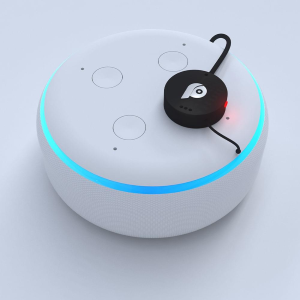 A small black wired button with a P symbol affixed to the mute button of a smart speaker.