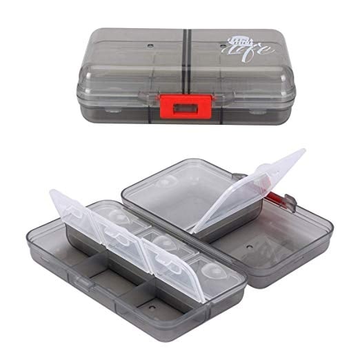 A small clear plastic pill suitcase in two images, one closed and one open showing 6 small interior compartments and two larger interior compartments.
