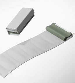 A mat with a head rest and wire trailing and an image of the mat folded to look like a slender rectangular box.