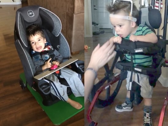 Two boys using specialized pediatric mobility devices. One is seated in a car seat on a wheeled platform controlled by a joystick, the other is standing in a walker with torso support and a head pod.