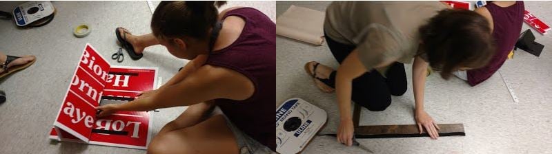 Left: a woman sitting on the floor building with a corrugated plastic campaign signs, tools and materials beside her. Right: a woman kneeling while measuring and cutting Uline tape.